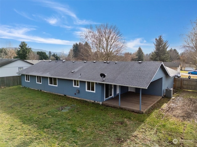 back of property with a yard, a patio, and central AC unit