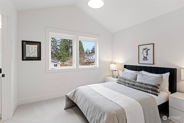 bedroom with carpet and lofted ceiling