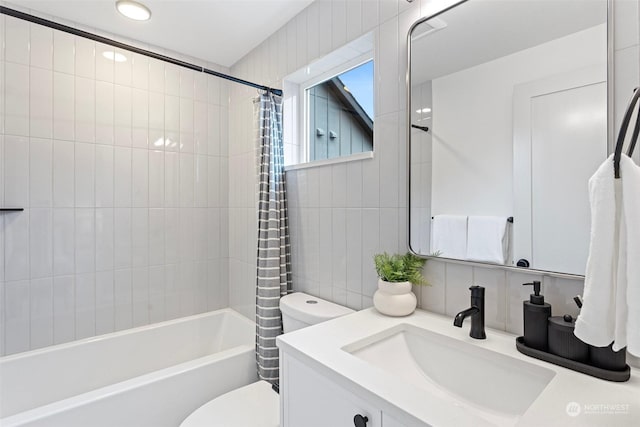 full bathroom featuring tasteful backsplash, vanity, shower / tub combo with curtain, tile walls, and toilet