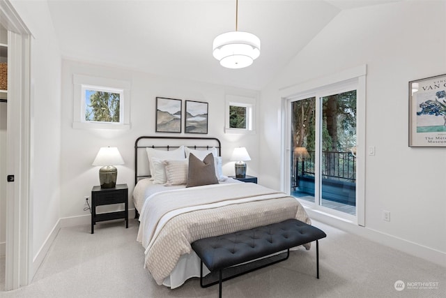 carpeted bedroom with lofted ceiling and access to outside