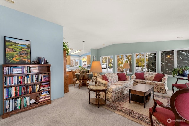 carpeted living room featuring vaulted ceiling