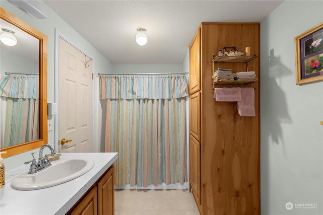 bathroom featuring vanity and walk in shower