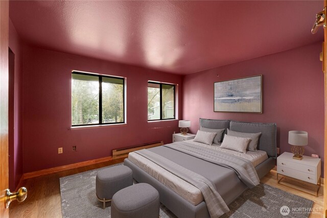 13231 SE 256th St Unit K4, Kent, WA 98042 - bedroom featuring wood finished floors and baseboard heating