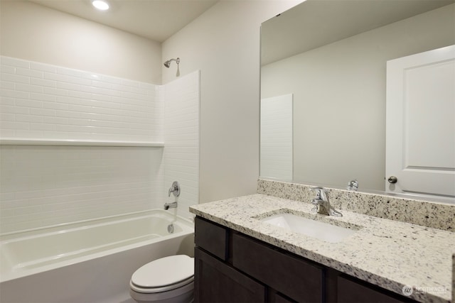 full bathroom with bathtub / shower combination, vanity, and toilet