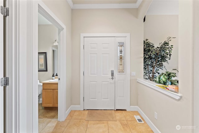 tiled entryway with crown molding