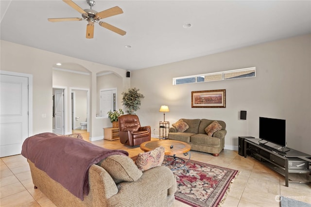 tiled living room with ceiling fan