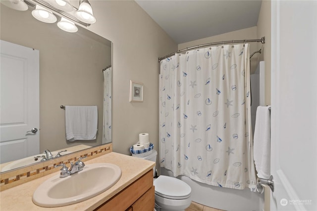 full bathroom with tile patterned flooring, vanity, shower / bath combo, and toilet