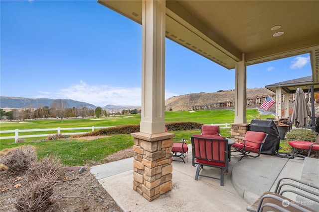 view of patio / terrace featuring a mountain view