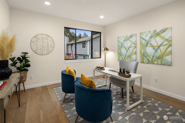 home office with hardwood / wood-style flooring