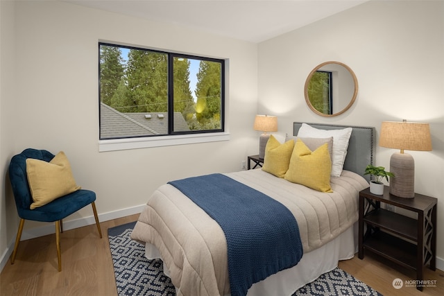 bedroom with wood-type flooring