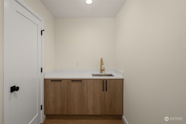 bathroom featuring hardwood / wood-style flooring and sink