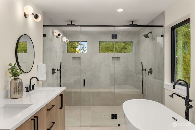 bathroom with separate shower and tub and vanity