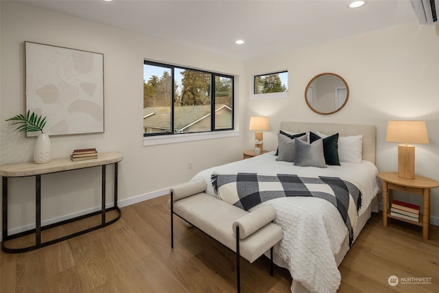 bedroom with wood-type flooring