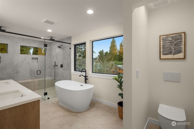 full bathroom featuring separate shower and tub, tile patterned floors, vanity, and toilet