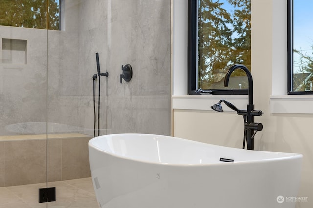 bathroom with sink and a bath