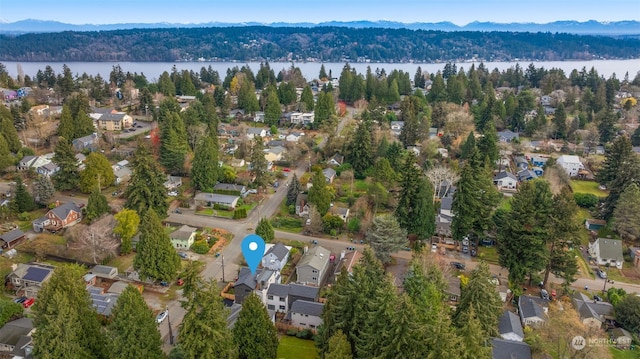 aerial view featuring a water and mountain view