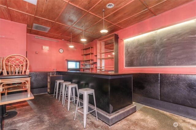 bar featuring concrete floors