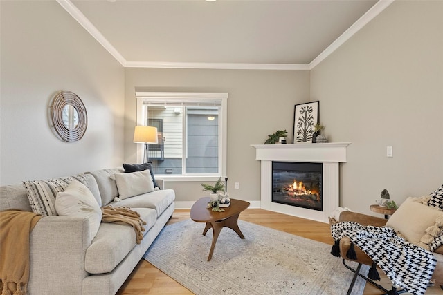 living room with hardwood / wood-style floors and ornamental molding