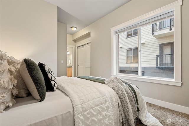 carpeted bedroom with a closet