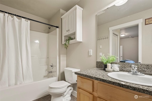 full bathroom featuring shower / bath combo, vanity, toilet, and tile patterned floors