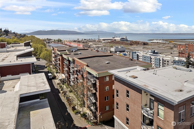 birds eye view of property with a water and mountain view