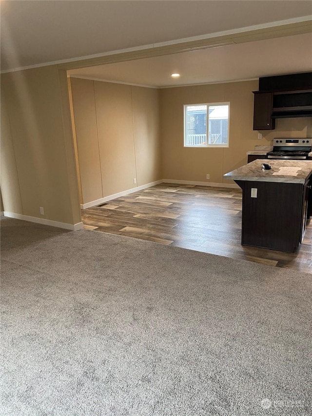 interior space with hardwood / wood-style floors and ornamental molding