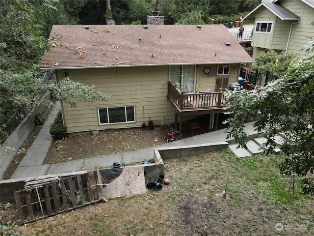 rear view of property with a deck