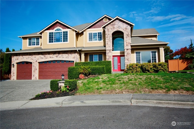 view of front facade with a front lawn and a garage