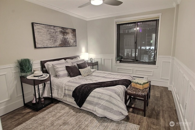 bedroom with ceiling fan, dark hardwood / wood-style floors, and ornamental molding