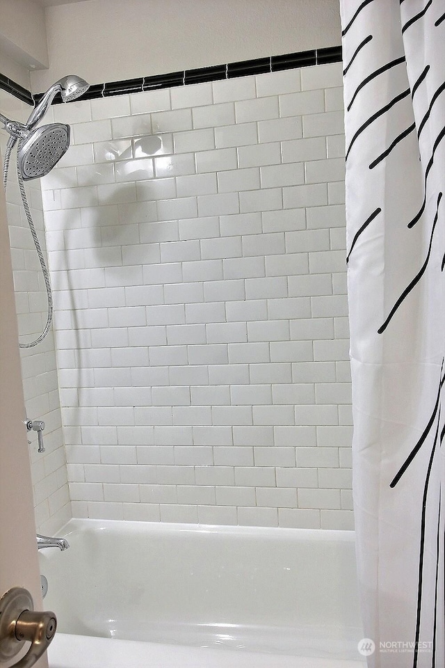 bathroom featuring shower / tub combo with curtain