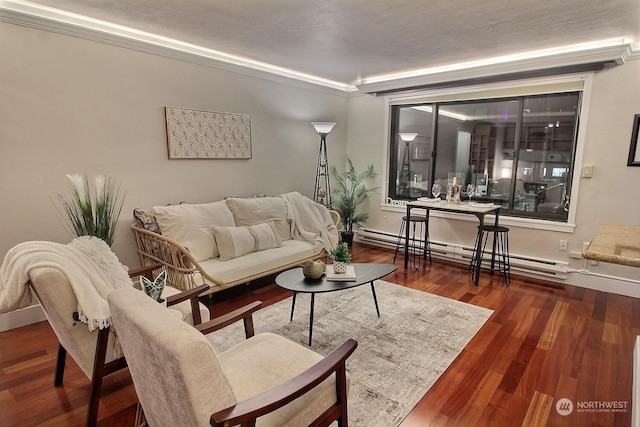 living room featuring ornamental molding, a textured ceiling, dark hardwood / wood-style floors, and a baseboard heating unit