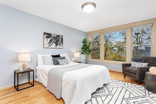 bedroom with light hardwood / wood-style floors