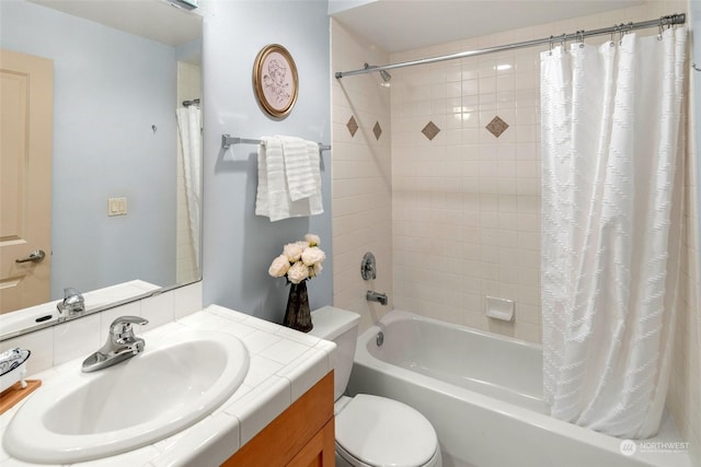 full bathroom with vanity, toilet, and shower / bath combo with shower curtain