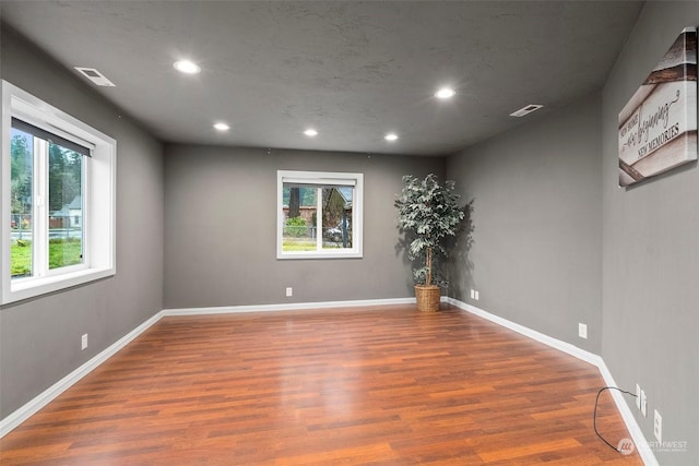 empty room featuring hardwood / wood-style floors