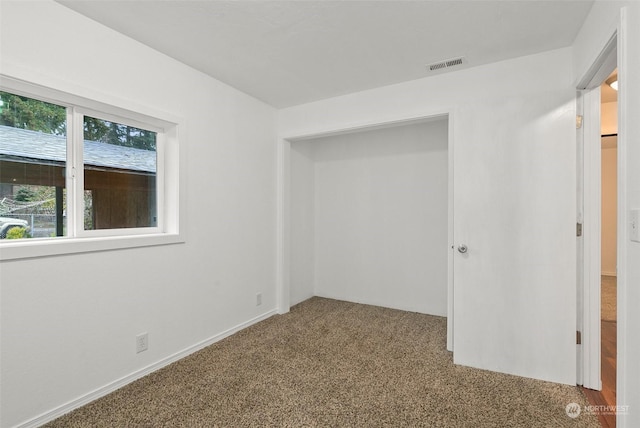 spare room with carpet floors