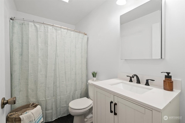 bathroom featuring vanity and toilet