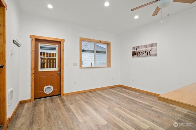 empty room featuring light hardwood / wood-style flooring and ceiling fan