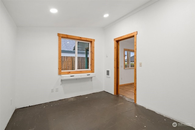 unfurnished room with lofted ceiling