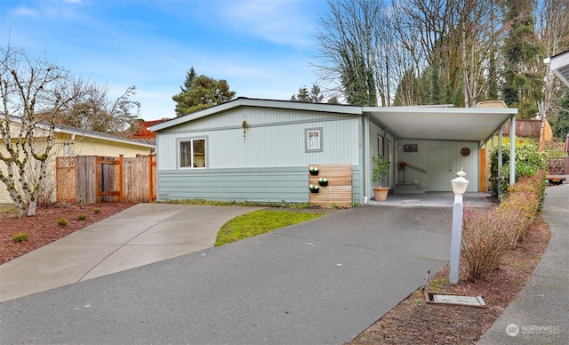 view of front of home featuring a carport