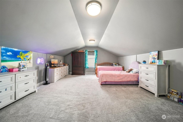 carpeted bedroom featuring lofted ceiling