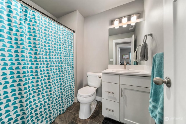 bathroom with vanity and toilet