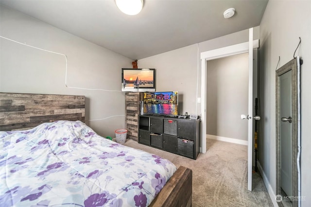 carpeted bedroom featuring lofted ceiling