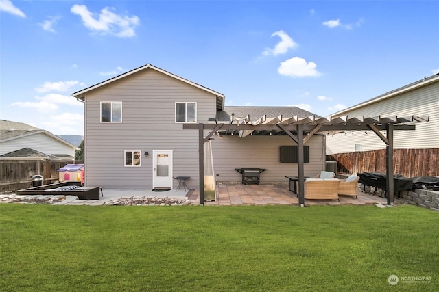 back of property featuring an outdoor living space, a pergola, a patio, and a yard