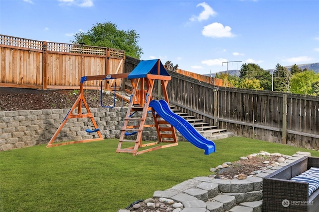 view of jungle gym featuring a lawn