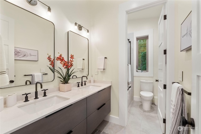 full bathroom with shower / tub combination, tile patterned floors, vanity, and toilet