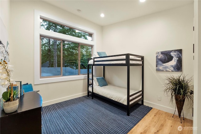 bedroom with hardwood / wood-style floors