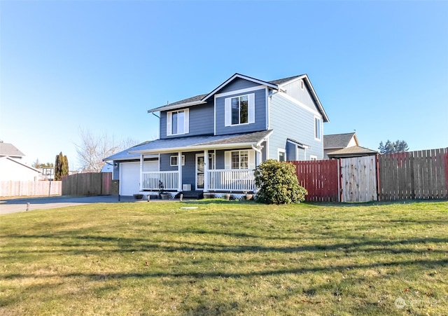 view of front of home featuring a porch, a garage, and a front lawn