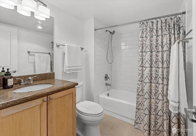 full bathroom featuring tile patterned flooring, shower / tub combo, vanity, and toilet