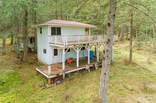 back of property with a deck