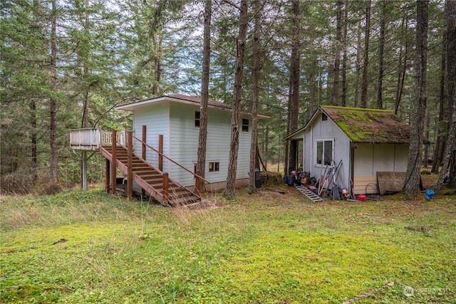 exterior space featuring a wooden deck and a storage unit